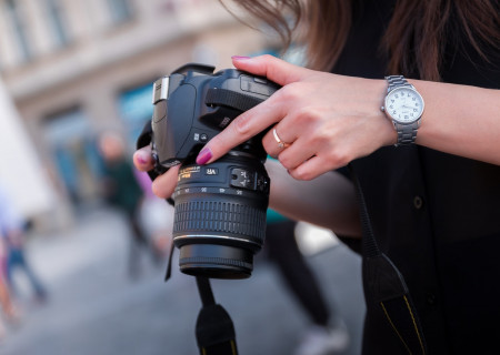 woman-holding-black-dslr-camera-167832