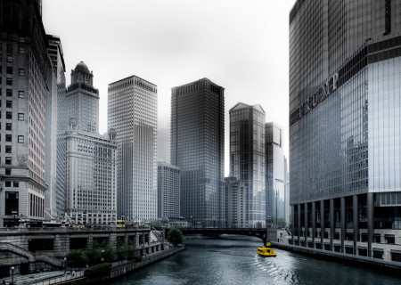 photo-of-boat-going-through-river-in-between-highrise-1209982