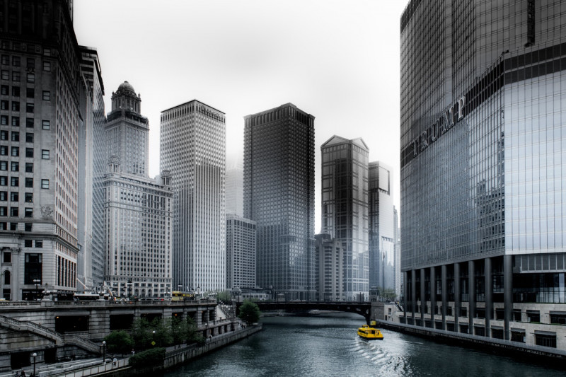 photo-of-boat-going-through-river-in-between-highrise-1209982-2