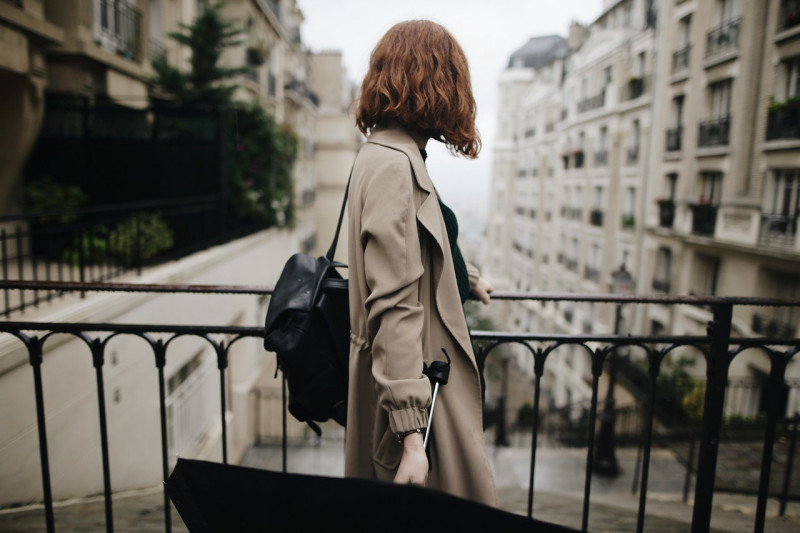 shallow-focus-photography-of-woman-beside-fence-1684915