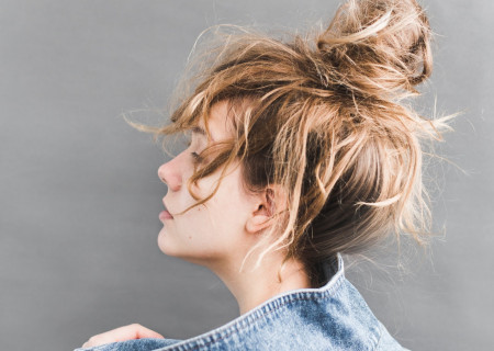 back-view-of-woman-holding-her-denim-jacket-789812