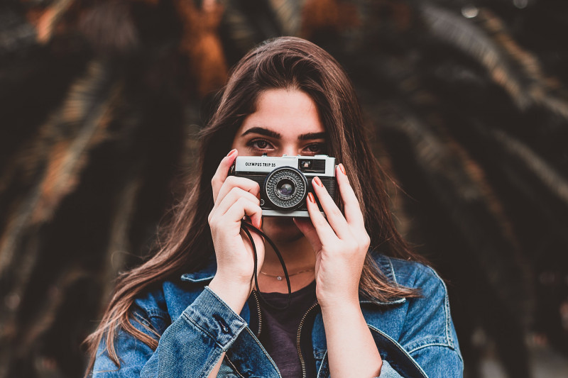 woman-holding-camera-1960183